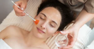 A woman receiving a professional chemical peel treatment in Hammond, LA